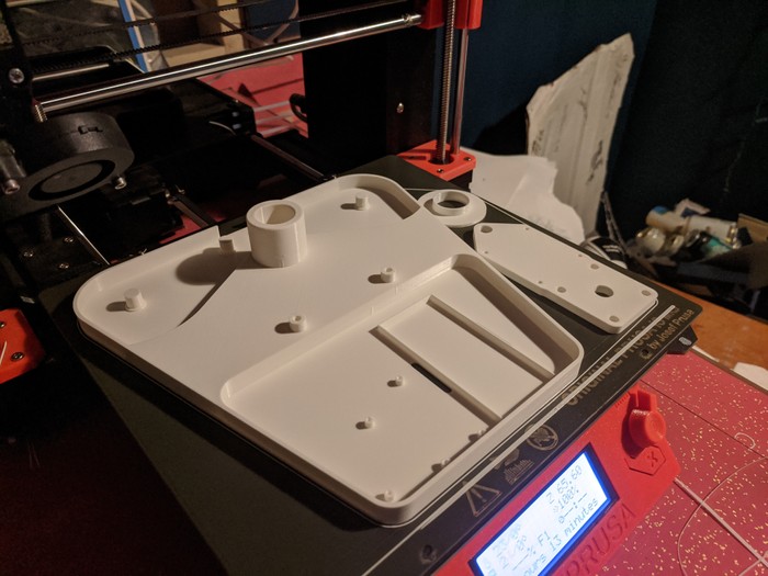 3d printed parts sitting ont the printer